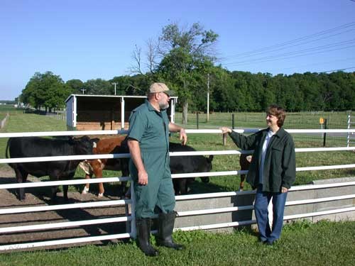 The Vet standing with the Farmer